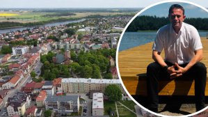 W tle Olecko z lotu ptaka. Po prawej burmistrz Olecka, Karol Sobczak